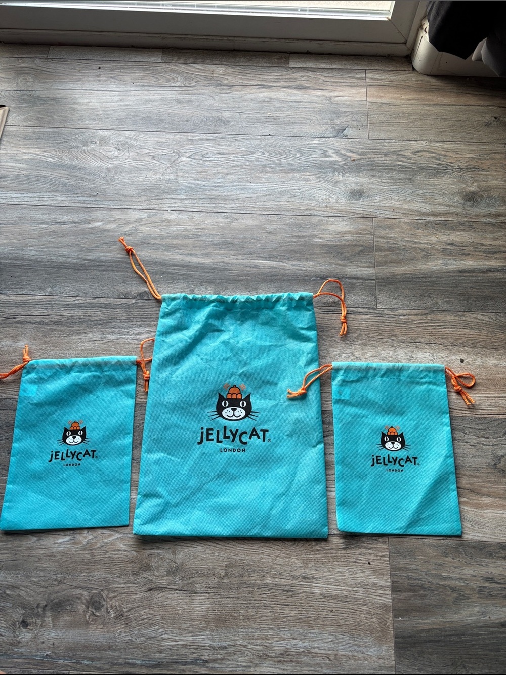 Jellycat Turquoise Drawstring Pouch Trio with Orange Ties